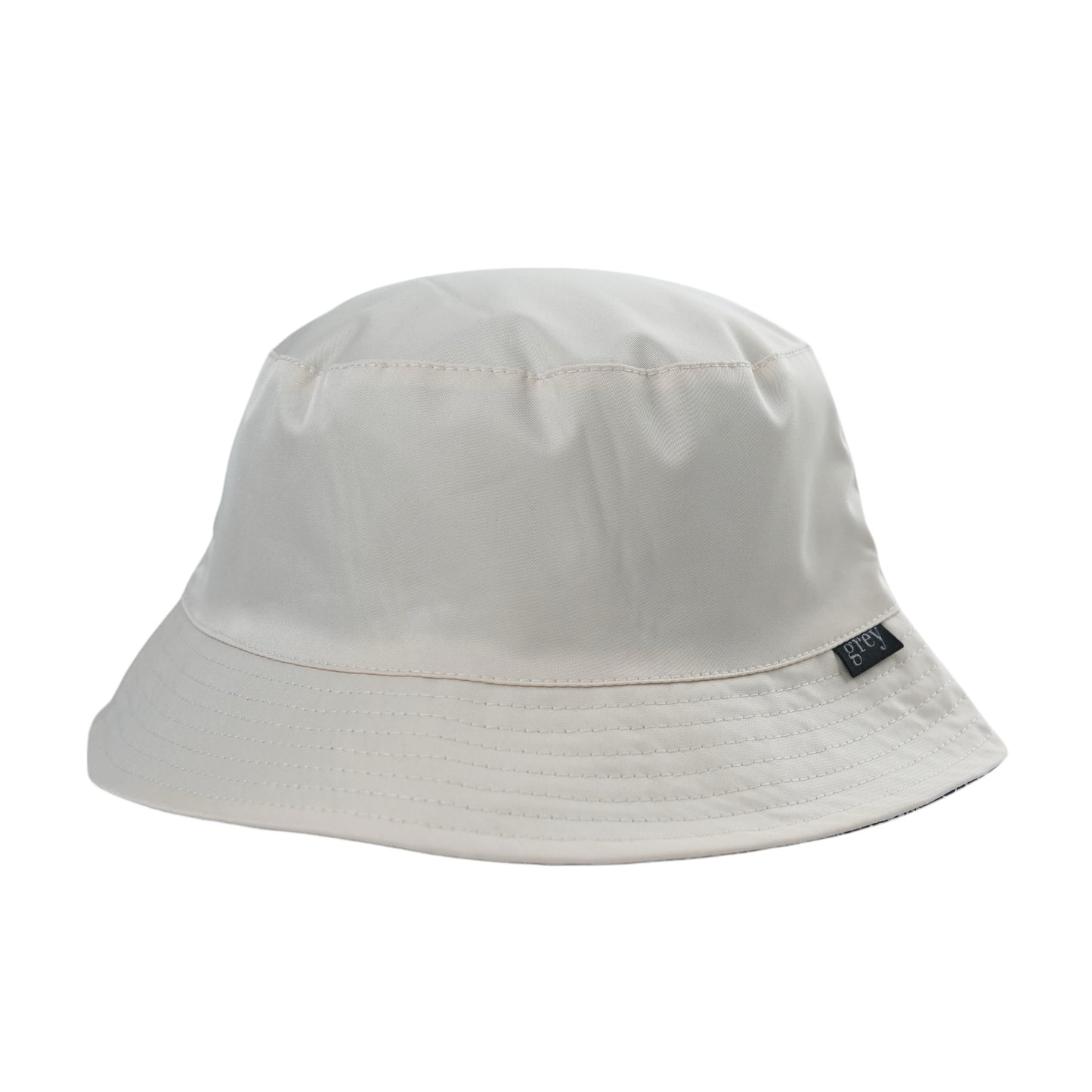 Grey By Ortenhill Avery Reversible Bucket Hat (Beige with Logo on Navy)