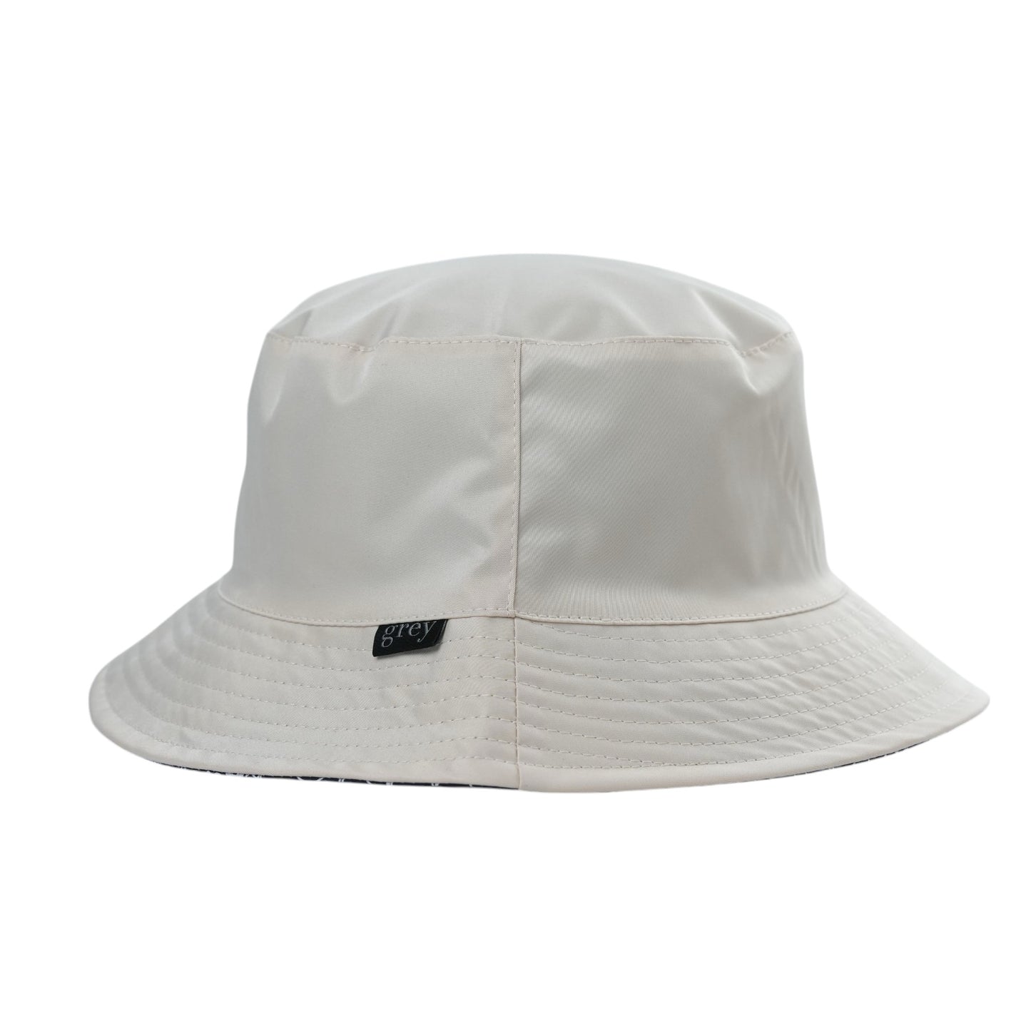 Grey By Ortenhill Avery Reversible Bucket Hat (Beige with Logo on Navy)